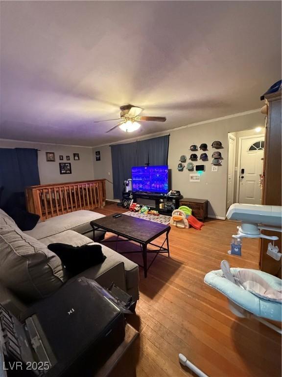 1016 Park Ave, Ely, NV 89301 - living area featuring ceiling fan, ornamental molding, and hardwood / wood-style floors