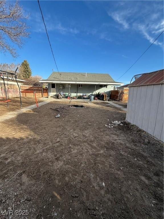 1016 Park Ave, Ely, NV 89301 - rear view of property with a storage unit, an outdoor structure, and fence