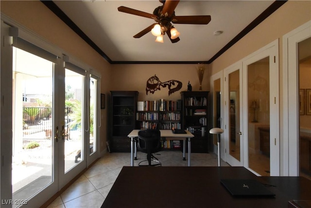 office featuring a ceiling fan, crown molding, light tile patterned floors, and french doors