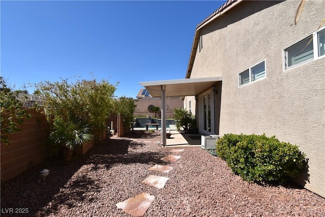 view of yard featuring a patio and a fenced backyard