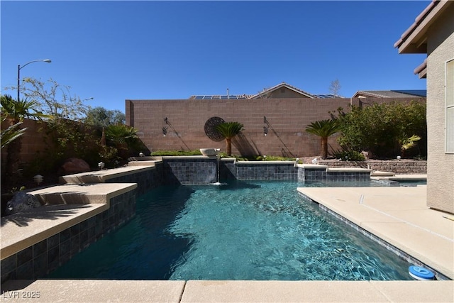 view of swimming pool featuring a fenced backyard and a fenced in pool