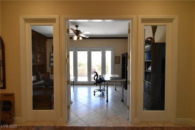 tiled office featuring a ceiling fan