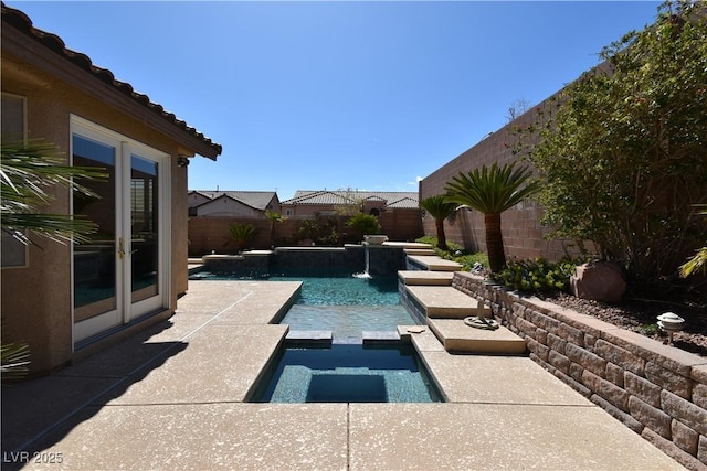 view of swimming pool featuring a pool with connected hot tub, french doors, a fenced backyard, and a patio area