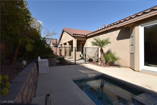 view of pool featuring a patio and fence