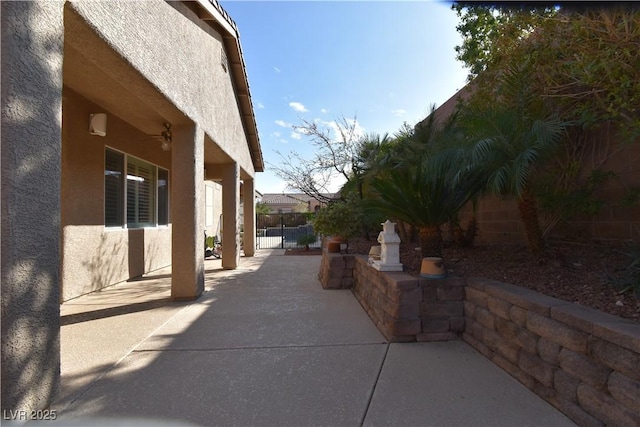 view of patio / terrace featuring fence