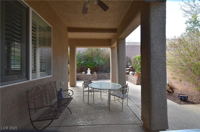 view of patio / terrace with outdoor dining area and ceiling fan