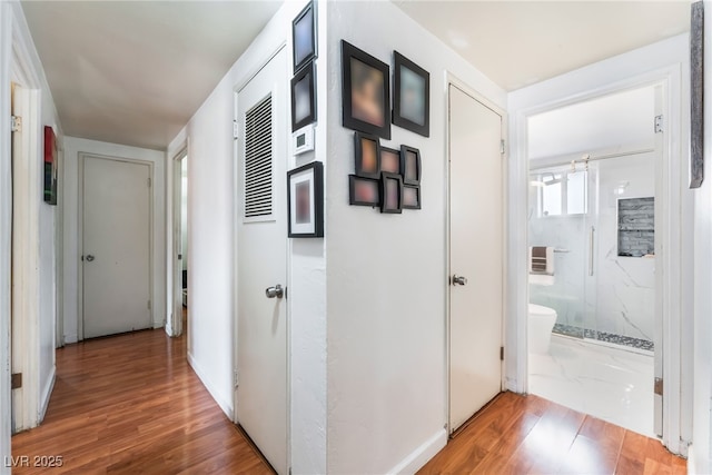 hallway with wood finished floors