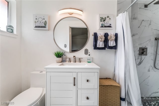 full bathroom featuring vanity, toilet, and a stall shower