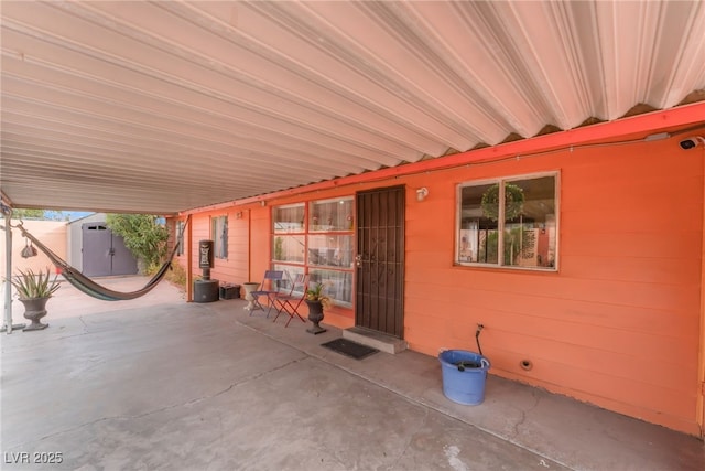 view of patio / terrace featuring an outdoor structure and a storage unit