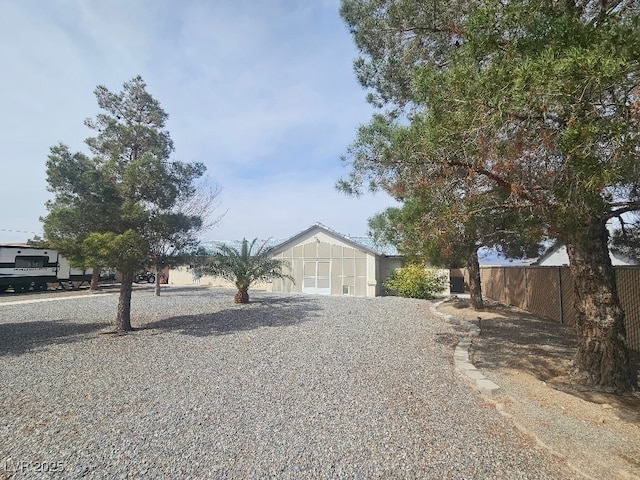 view of front of house with board and batten siding and fence