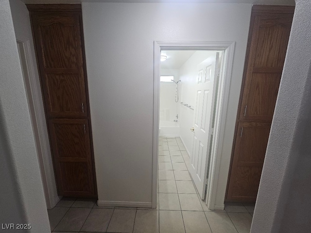hallway featuring light tile patterned floors