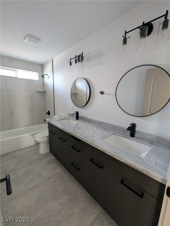 full bath with toilet, a sink, double vanity, and  shower combination
