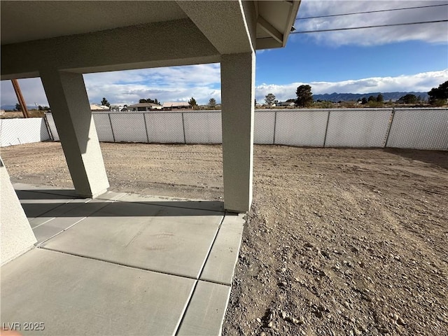 view of yard featuring a patio and a fenced backyard