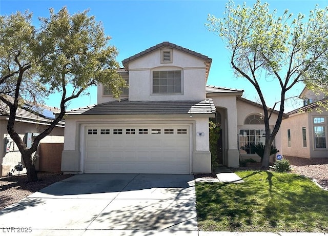 981 Leadville Meadows Dr, Henderson, NV 89052 - view of front facade featuring stucco siding, concrete driveway, a garage, a tiled roof, and a front lawn