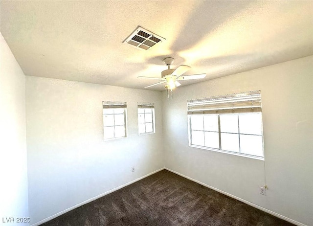 981 Leadville Meadows Dr, Henderson, NV 89052 - unfurnished room with ceiling fan, dark colored carpet, baseboards, and a textured ceiling