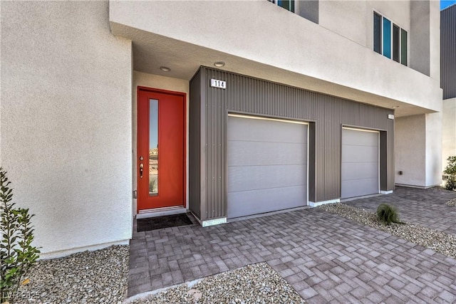 8629 Ensworth St Unit 114, Las Vegas, NV 89123 - garage featuring decorative driveway