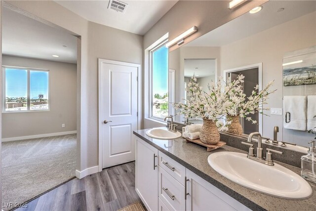 8629 Ensworth St Unit 114, Las Vegas, NV 89123 - bathroom with double vanity and wood finished floors