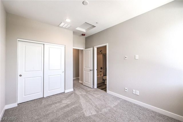 8629 Ensworth St Unit 114, Las Vegas, NV 89123 - unfurnished bedroom featuring carpet, a closet, ensuite bathroom, and recessed lighting