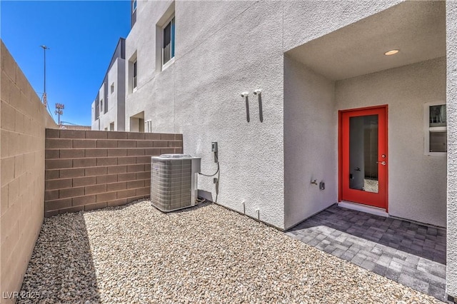 8629 Ensworth St Unit 114, Las Vegas, NV 89123 - view of home's exterior featuring stucco siding and a cooling unit