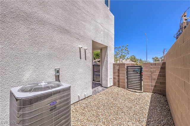 8629 Ensworth St Unit 114, Las Vegas, NV 89123 - view of home's exterior with a gate and stucco siding