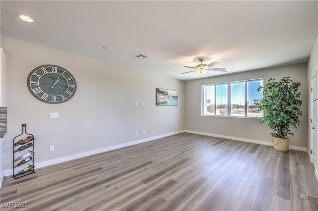 8629 Ensworth St Unit 114, Las Vegas, NV 89123 - unfurnished room featuring wood finished floors, ceiling fan, and recessed lighting