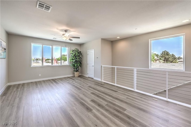 8629 Ensworth St Unit 114, Las Vegas, NV 89123 - empty room featuring wood finished floors, ceiling fan, and recessed lighting