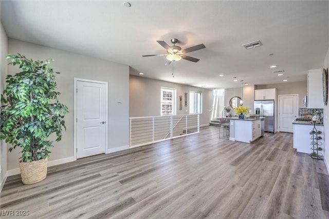 8629 Ensworth St Unit 114, Las Vegas, NV 89123 - living area featuring a ceiling fan, light wood-style flooring, and recessed lighting
