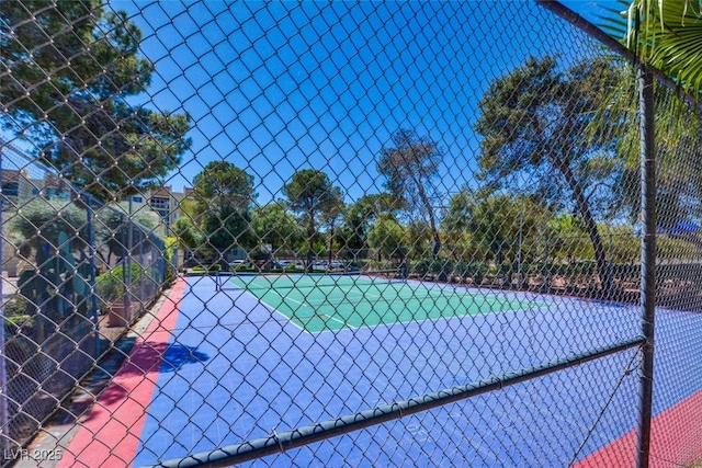 view of sport court with fence
