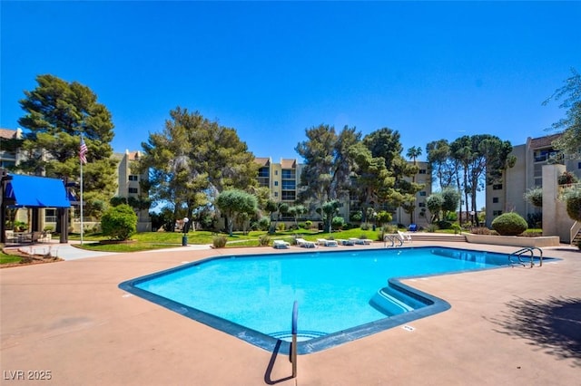 community pool featuring a patio area