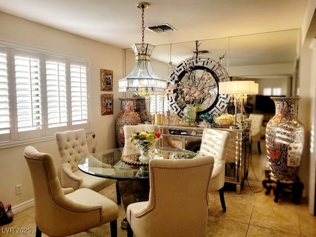 4019 Delos Dr, Las Vegas, NV 89103 - dining area featuring light tile patterned floors, baseboards, and visible vents