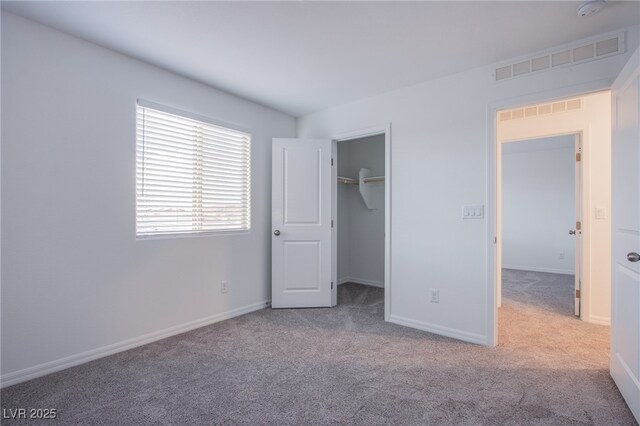 5748 Avondale Rise Way, Las Vegas, NV 89141 - unfurnished bedroom featuring carpet flooring, baseboards, and a spacious closet