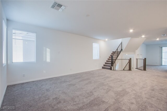 5748 Avondale Rise Way, Las Vegas, NV 89141 - unfurnished living room featuring carpet, baseboards, and recessed lighting