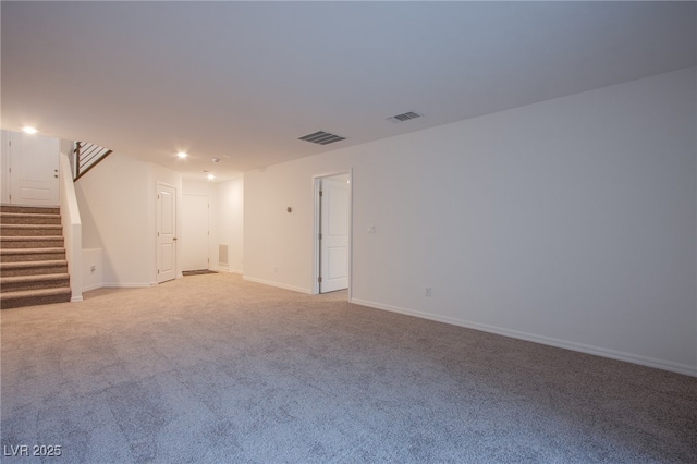 5748 Avondale Rise Way, Las Vegas, NV 89141 - unfurnished living room featuring stairway, light carpet, and baseboards