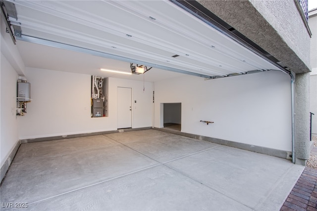 5748 Avondale Rise Way, Las Vegas, NV 89141 - garage featuring a garage door opener, baseboards, and water heater
