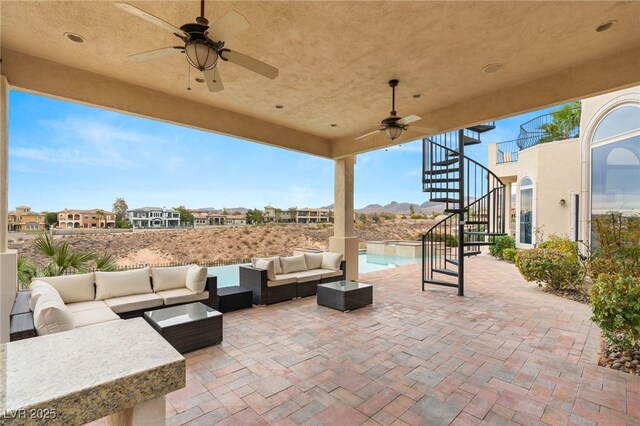 2660 Mirabella St, Henderson, NV 89052 - view of patio / terrace with stairway, a ceiling fan, a pool with connected hot tub, and an outdoor hangout area