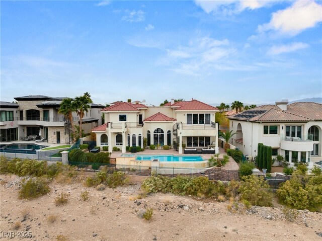 2660 Mirabella St, Henderson, NV 89052 - back of property with a fenced backyard, a tiled roof, a balcony, stucco siding, and a patio