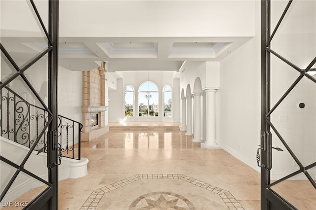 2660 Mirabella St, Henderson, NV 89052 - foyer featuring coffered ceiling, beamed ceiling, a premium fireplace, baseboards, and decorative columns