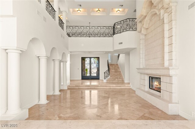 2660 Mirabella St, Henderson, NV 89052 - foyer entrance with stairway, marble finish floor, a towering ceiling, a fireplace, and coffered ceiling