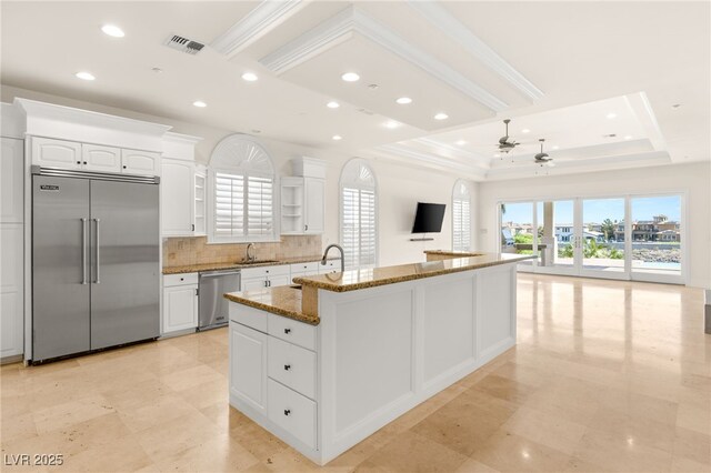 2660 Mirabella St, Henderson, NV 89052 - kitchen with stone countertops, a sink, a wealth of natural light, appliances with stainless steel finishes, and ceiling fan