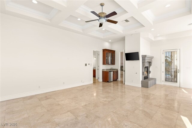 2660 Mirabella St, Henderson, NV 89052 - unfurnished living room featuring a tile fireplace, a towering ceiling, ceiling fan, and coffered ceiling