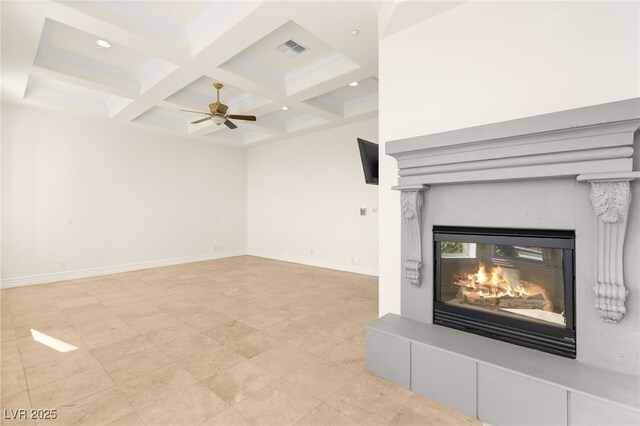 2660 Mirabella St, Henderson, NV 89052 - unfurnished living room with a glass covered fireplace, ceiling fan, beamed ceiling, coffered ceiling, and visible vents