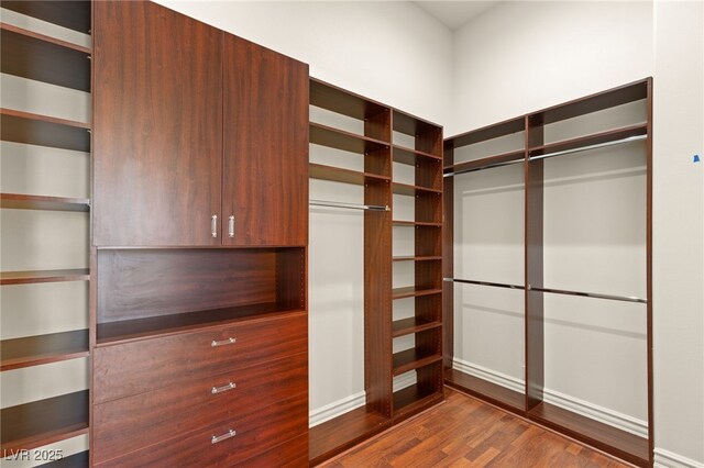 2660 Mirabella St, Henderson, NV 89052 - walk in closet featuring dark wood-type flooring