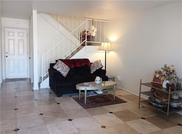 living room with tile patterned flooring and stairs