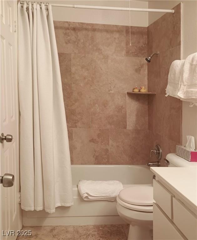 bathroom featuring shower / tub combo, toilet, and tile patterned floors