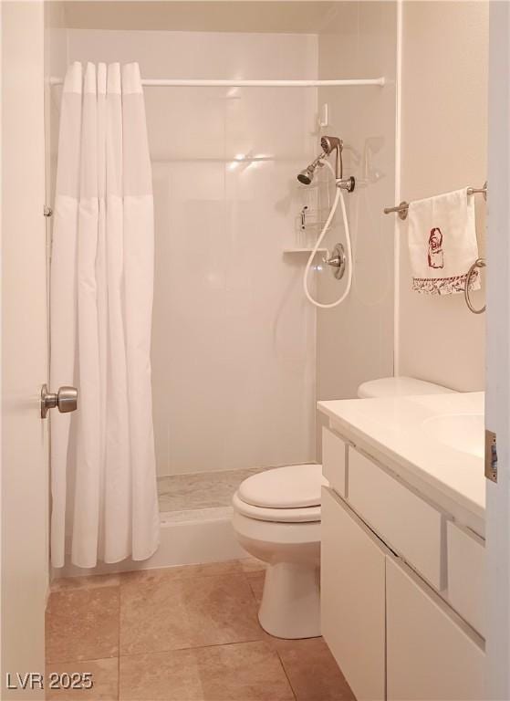 6412 Big Pine Way, Las Vegas, NV 89108 - full bathroom with tile patterned flooring, a shower with shower curtain, vanity, and toilet