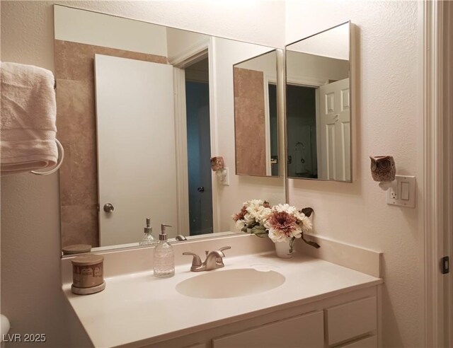 6412 Big Pine Way, Las Vegas, NV 89108 - bathroom with vanity and a textured wall
