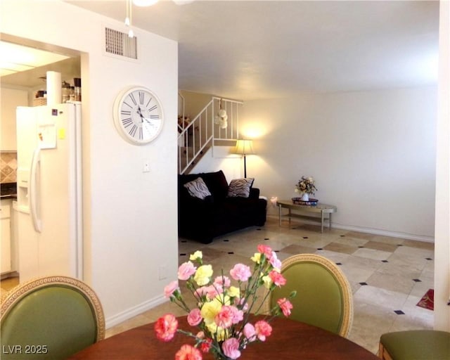6412 Big Pine Way, Las Vegas, NV 89108 - living room featuring stairway and baseboards