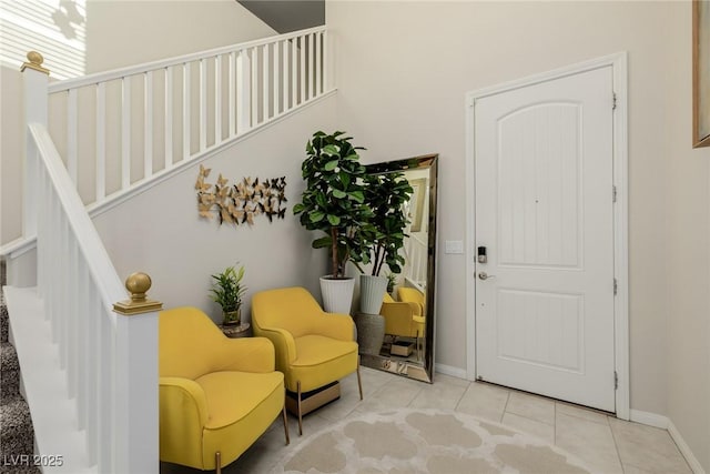 entrance foyer featuring tile patterned flooring and baseboards