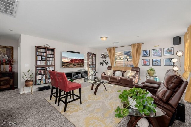 carpeted living area with visible vents