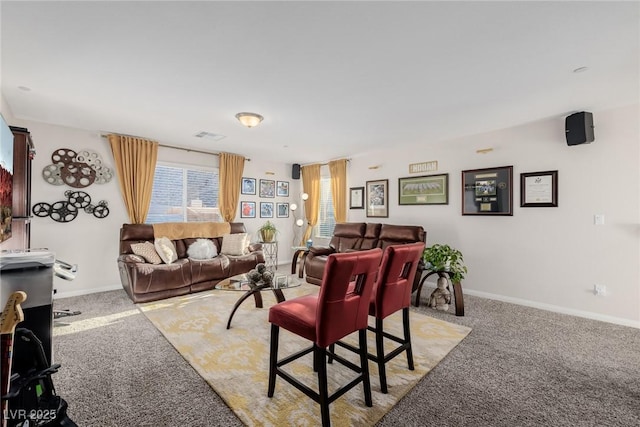 living area with light carpet, visible vents, and baseboards